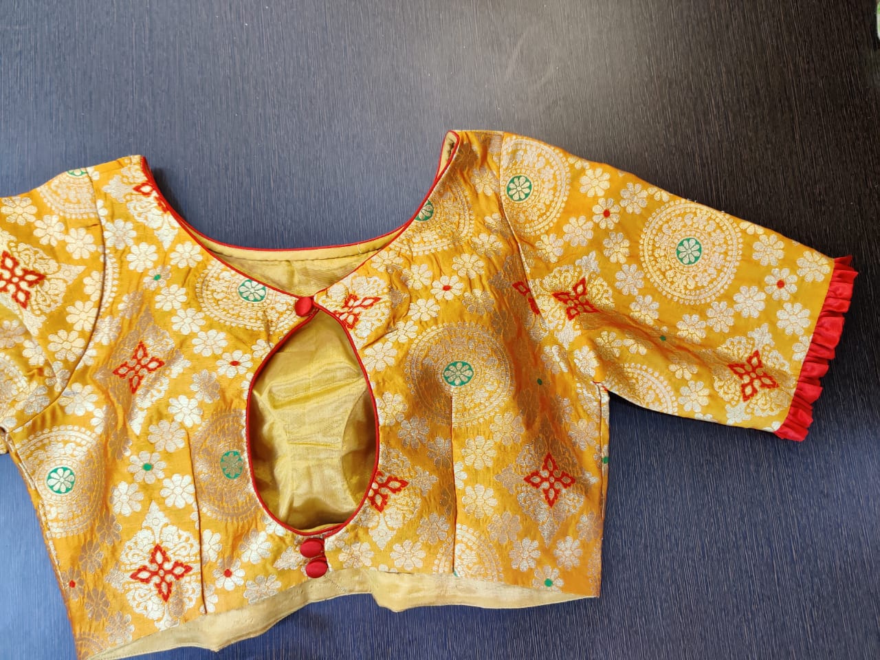Buy beautiful mustard Banarasi saree blouse online in USA with red frill sleeves. Elevate your Indian saree style with exquisite readymade saree blouses, embroidered saree blouses, Benarasi saree blouse, fancy saree blouse from Pure Elegance Indian clothing store in USA.-back