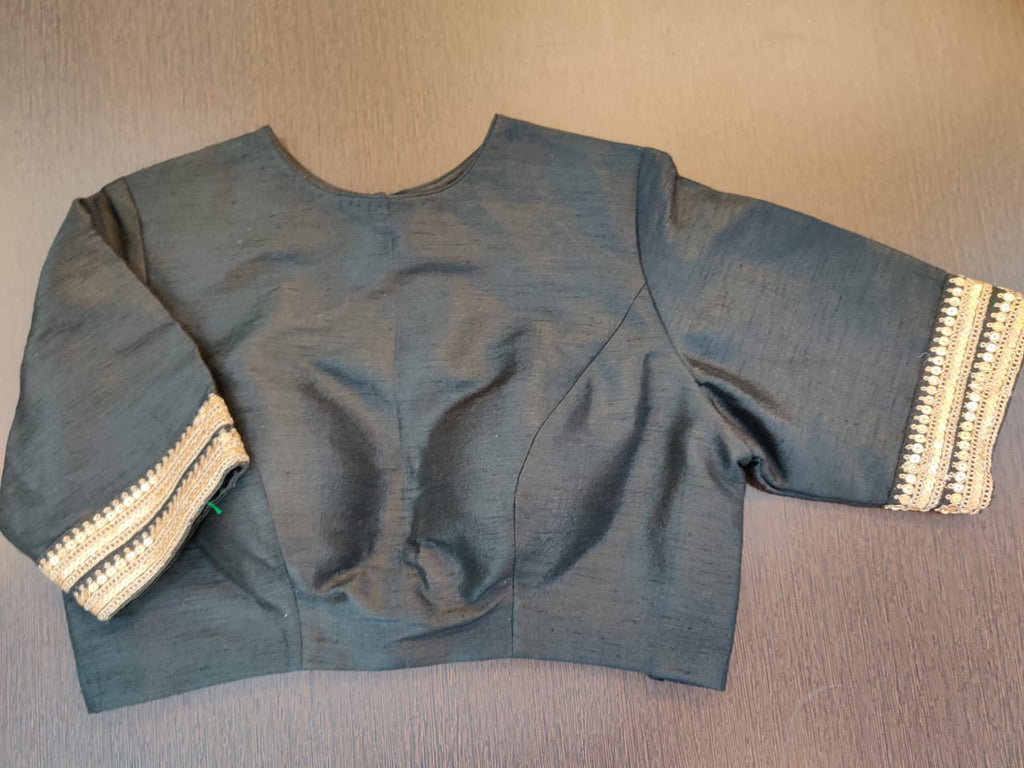 Buy stunning black designer saree blouse online in USA with embroidered border sleeves. Elevate your Indian saree style with exquisite readymade saree blouses, embroidered saree blouses, Banarasi saree blouse, fancy saree blouse from Pure Elegance Indian clothing store in USA.-front