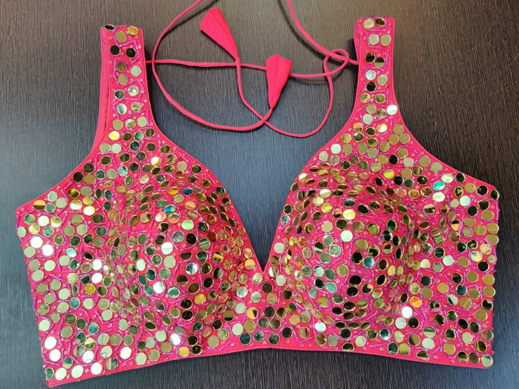 Shop beautiful pink mirror work sleeveless designer saree blouse online in USA. Elevate your Indian saree style with exquisite readymade saree blouses, embroidered saree blouses, Banarasi sari blouse, fancy saree blouse from Pure Elegance Indian clothing store in USA.-front