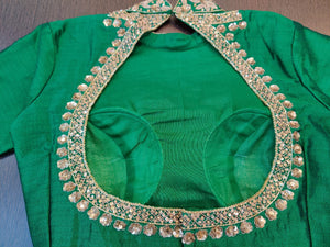 Shop beautiful green designer saree blouse online in USA with heavy embroidery neckline. Elevate your Indian saree style with exquisite readymade saree blouses, embroidered saree blouses, Banarasi sari blouse, fancy saree blouse from Pure Elegance Indian clothing store in USA.-back