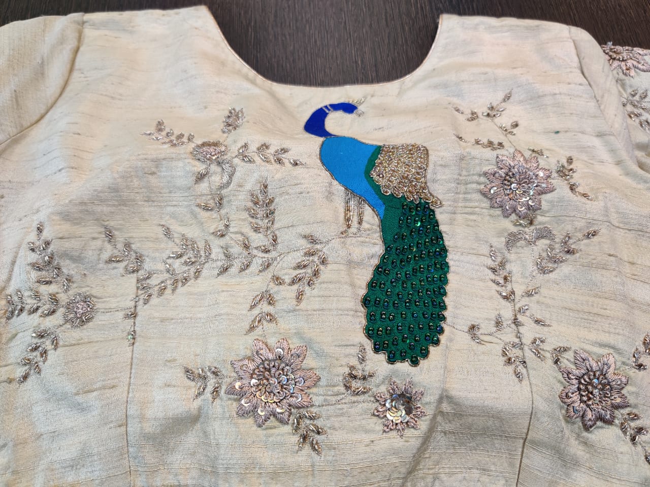 Buy beautiful cream designer saree blouse online in USA with peacock motif on back. Elevate your Indian saree style with exquisite readymade saree blouses, embroidered saree blouses, Banarasi sari blouse, fancy saree blouse from Pure Elegance Indian clothing store in USA.-back