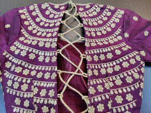 Buy beautiful purple sari blouse online in USA with golden embroidery. Elevate your Indian saree style with exquisite readymade saree blouses, embroidered saree blouses, Banarasi sari blouse, fancy saree blouse from Pure Elegance Indian clothing store in USA.-back