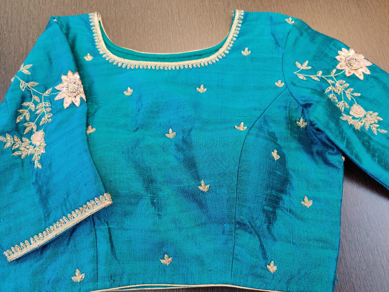 Shop stunning blue designer saree blouse online in USA with embroidered peacock motif on the back. Elevate your Indian saree style with exquisite readymade saree blouses, embroidered saree blouses, Banarasi sari blouse, fancy saree blouse from Pure Elegance Indian clothing store in USA.-front