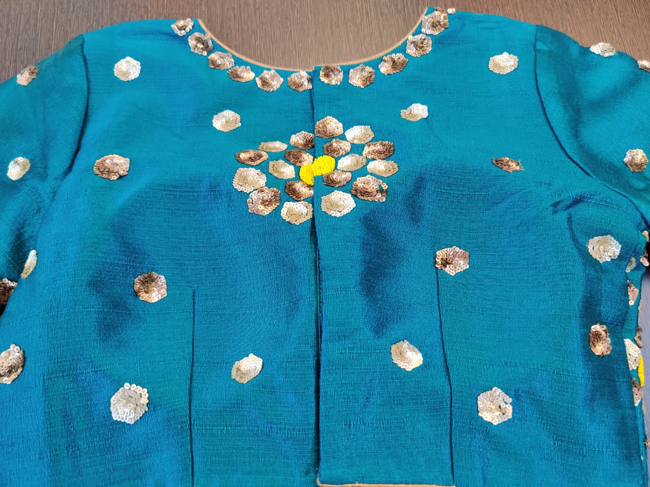 Buy gorgeous turquoise blue sequin and bead embroidery sari blouse online in USA. Elevate your Indian saree style with exquisite readymade saree blouses, embroidered saree blouses, Banarasi sari blouse, fancy saree blouse from Pure Elegance Indian clothing store in USA.-back