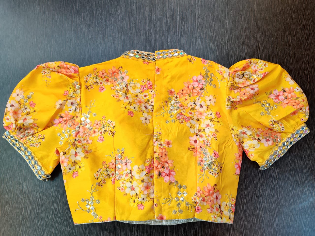 Shop beautiful yellow floral mirror work designer sari blouse online in USA with puff sleeves. Elevate your Indian saree style with exquisite ready made sari blouses, embroidered sari blouses, Benarasi saree blouse, fancy saree blouse from Pure Elegance Indian clothing store in USA.-back