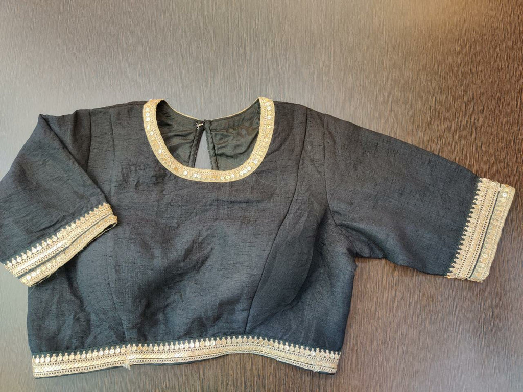 Shop stunning black designer saree blouse online in USA with embroidered border. Elevate your Indian saree style with exquisite ready made sari blouses, embroidered sari blouses, Benarasi saree blouse, fancy saree blouse from Pure Elegance Indian clothing store in USA.-front
