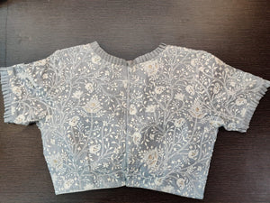 Shop grey embroidered saree blouse online in USA with frill edging. Elevate your Indian saree style with exquisite readymade sari blouses, embroidered saree blouses, Benarasi saree blouse, fancy saree blouse from Pure Elegance Indian clothing store in USA.-back