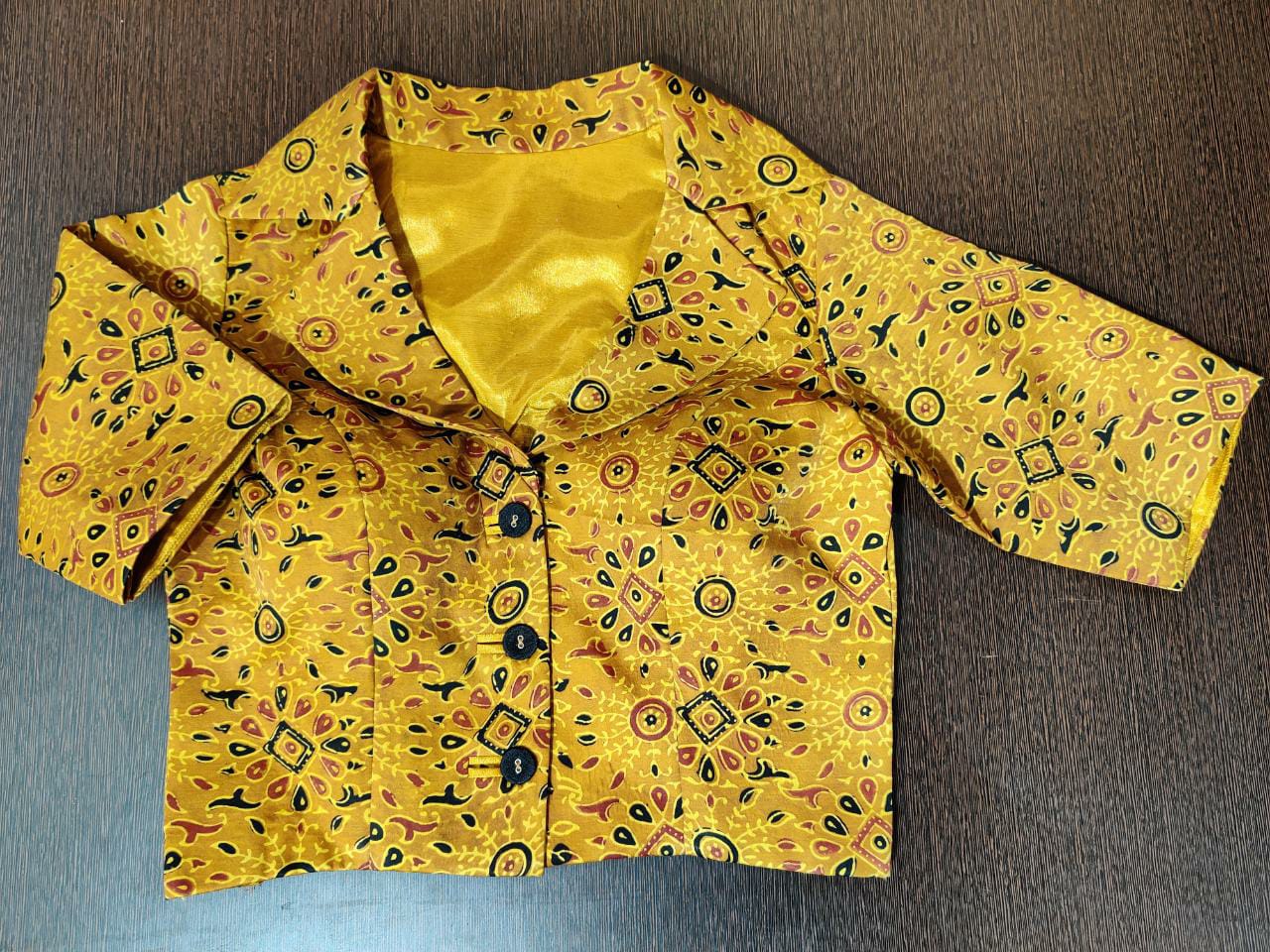 Buy gorgeous yellow printed saree blouse online in USA with collar neckline. Elevate your Indian saree style with exquisite readymade saree blouses, embroidered saree blouses, Benarasi sari blouse, designer saree blouse from Pure Elegance Indian clothing store in USA.-front