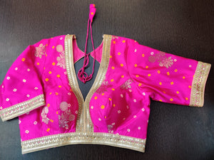 Shop gorgeous bright pink Bandhej embroidered sari blouse online in USA with zari buta. Elevate your Indian saree style with exquisite readymade saree blouse, embroidered saree blouses, Benarasi sari blouse, designer saree blouse from Pure Elegance Indian clothing store in USA.-front