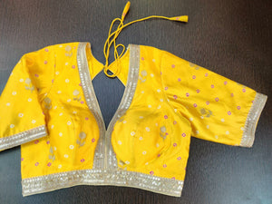 Buy gorgeous yellow yellow Bandhej embroidered sari blouse online in USA with zari buta. Elevate your Indian saree style with exquisite readymade saree blouse, embroidered saree blouses, Benarasi sari blouse, designer saree blouse from Pure Elegance Indian clothing store in USA.-full view