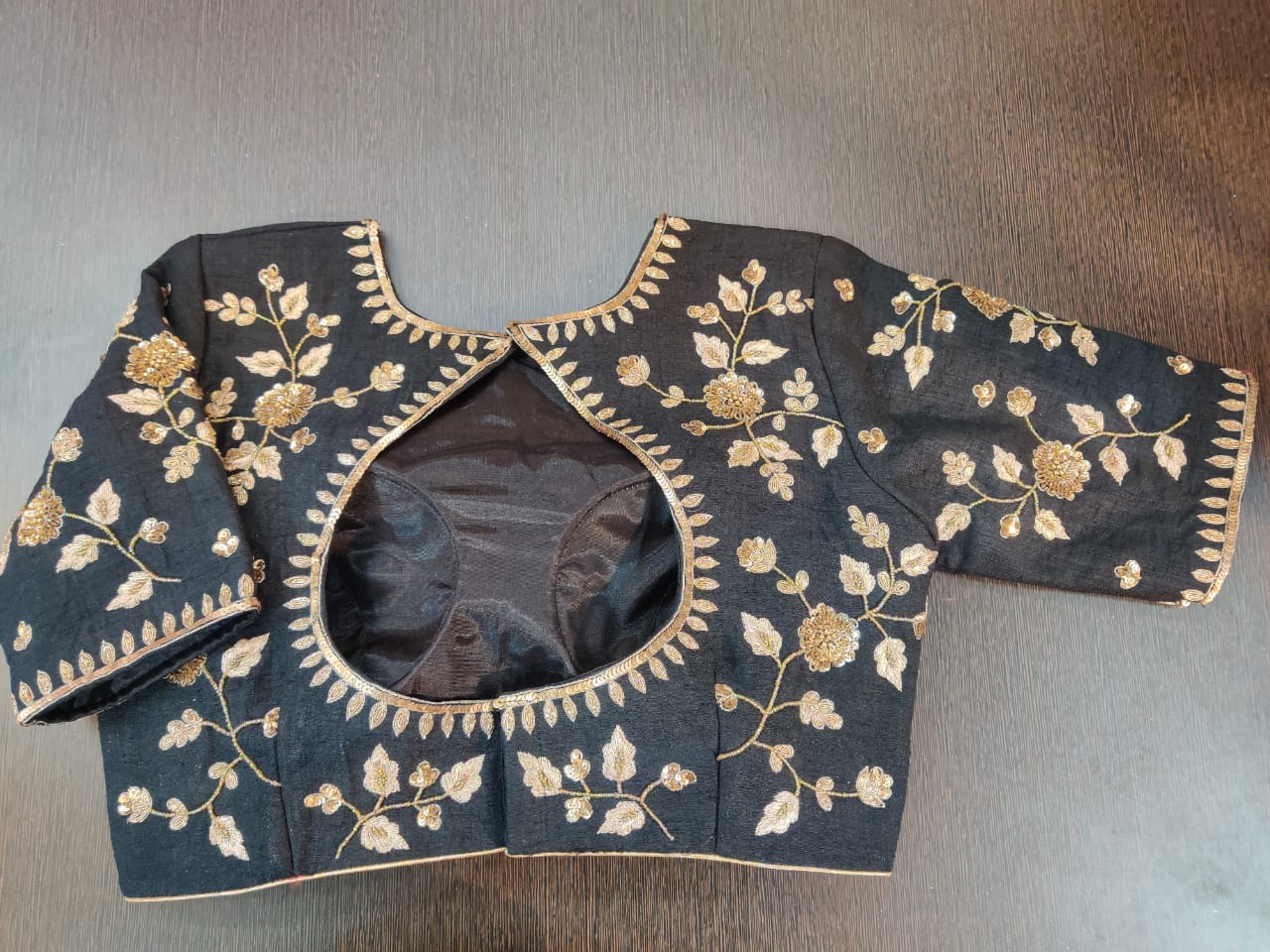 Shop stunning black designer saree blouse online in USA with golden embroidery. Elevate your Indian saree style with exquisite readymade sari blouse, embroidered saree blouses, Banarasi sari blouse, designer saree blouse from Pure Elegance Indian clothing store in USA.-back