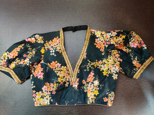 Shop stunning black floral saree blouse online in USA with puff sleeves. Elevate your Indian saree style with exquisite readymade sari blouse, embroidered saree blouses, Banarasi sari blouse, designer saree blouse from Pure Elegance Indian clothing store in USA.-front