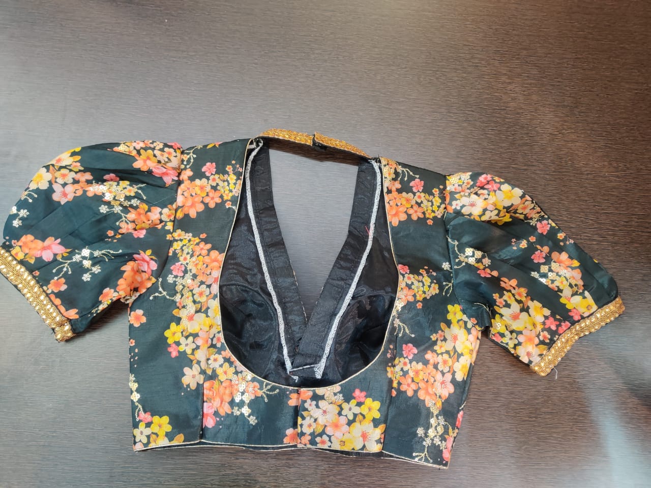 Shop stunning black floral saree blouse online in USA with puff sleeves. Elevate your Indian saree style with exquisite readymade sari blouse, embroidered saree blouses, Banarasi sari blouse, designer saree blouse from Pure Elegance Indian clothing store in USA.-back