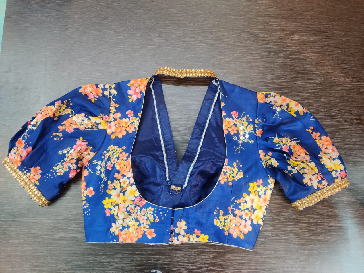 Buy gorgeous indigo blue floral saree blouse online in USA with puff sleeves. Elevate your Indian saree style with exquisite readymade sari blouse, embroidered saree blouses, Banarasi sari blouse, designer saree blouse from Pure Elegance Indian clothing store in USA.-back