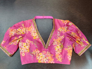 Buy stunning pink color floral saree blouse online in USA with puff sleeves. Elevate your Indian saree style with exquisite readymade sari blouse, embroidered saree blouses, Banarasi sari blouse, designer saree blouse from Pure Elegance Indian clothing store in USA.-front