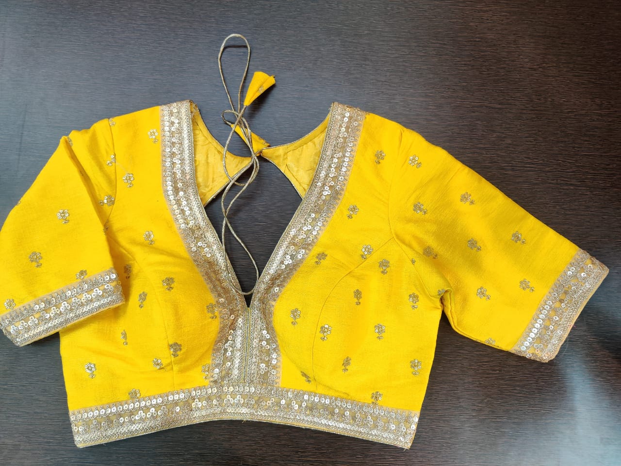Shop beautiful bright yellow designer saree blouse online in USA with golden embroidery. Elevate your Indian saree style with exquisite readymade sari blouse, embroidered saree blouses, Banarasi sari blouse, designer saree blouse from Pure Elegance Indian clothing store in USA.-front