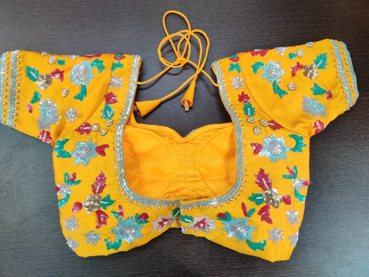 Buy stunning yellow designer saree blouse online in USA with golden embroidery. Elevate your Indian saree style with exquisite readymade sari blouse, embroidered saree blouses, Banarasi sari blouse, designer sari blouse from Pure Elegance Indian clothing store in USA.-back