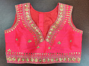 Shop stunning pink sleeveless gota patti sari blouse online in USA. Elevate your Indian saree style with exquisite readymade sari blouse, embroidered saree blouses, Banarasi sari blouse, designer saree blouse from Pure Elegance Indian clothing store in USA.-front