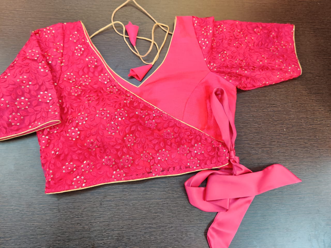 Buy stunning pink embroidered faux wrap saree blouse online in USA. Elevate your Indian saree style with exquisite readymade sari blouse, embroidered saree blouses, Banarasi sari blouse, designer sari blouse from Pure Elegance Indian clothing store in USA.-full view