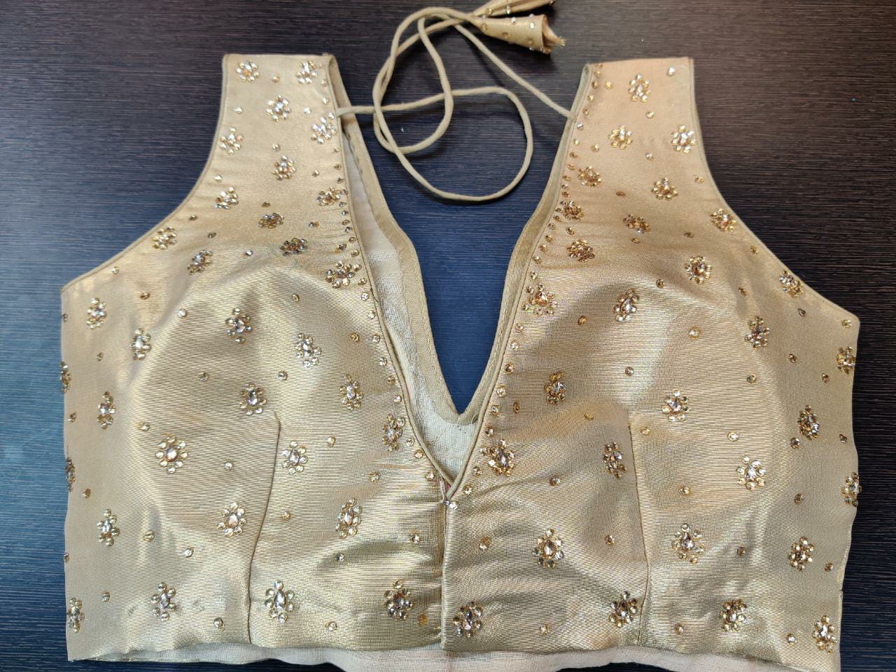 Buy gorgeous golden embellished sleeveless sari blouse online in USA. Elevate your Indian saree style with exquisite readymade sari blouse, embroidered saree blouses, Banarasi sari blouse, designer sari blouse from Pure Elegance Indian clothing store in USA.-back