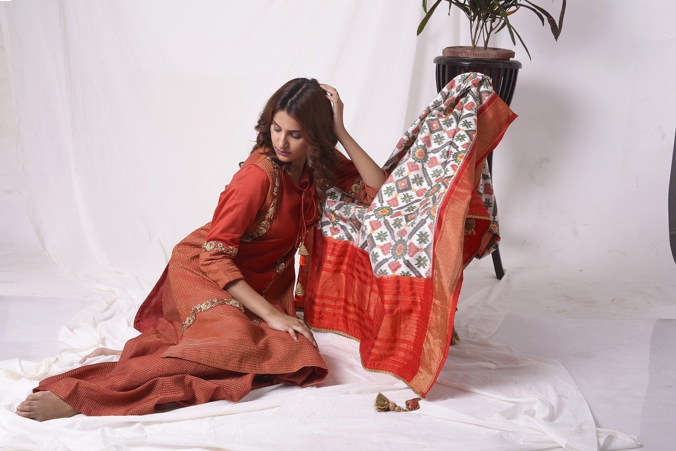 Buy red tissue chanderi suit online in USA with palazzo and dupatta. Be the talk of parties and weddings with exquisite designer gowns, Indian suits, Anarkali dresses, Indowestern dresses from Pure Elegance Indian clothing store in USA. Shop online now.-close up