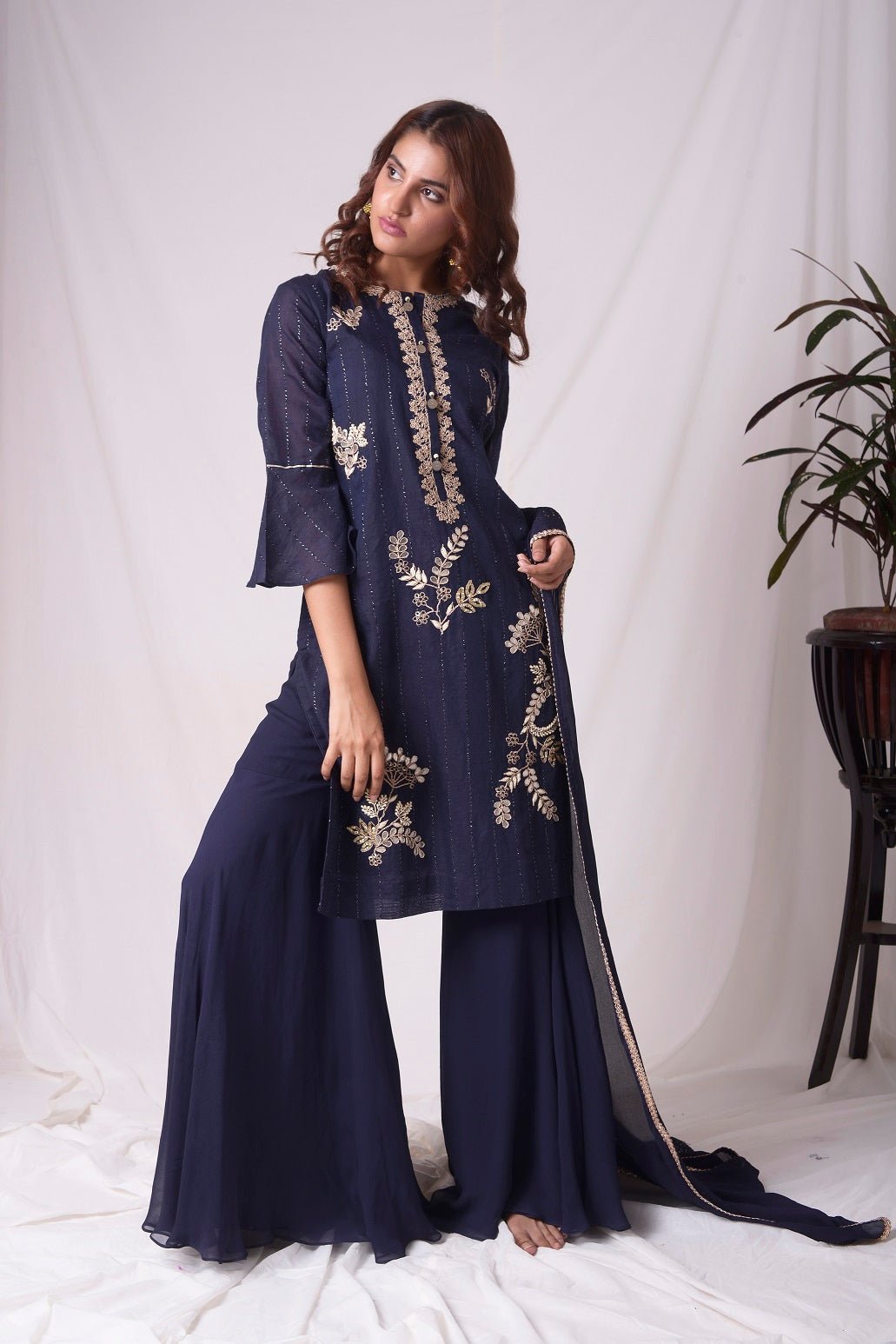 Buy cobalt blue chanderi suit online in USA. Suit has simple gotta patti work,circular flounce sleeves with delicate design,complementing palazzo and duppatta. Simple look makes it elegant.Be the talk of parties and weddings with exquisite designer gowns from Pure Elegance Indian clothing store in USA. Shop online now.-full view-2