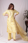 Buy yellow silk suit online in USA with kachi patti work. Be the talk of parties and weddings with exquisite designer gowns, sharara suits, Anarkali suits, salwar suits from Pure Elegance Indian clothing store in USA. Shop online now.-full view