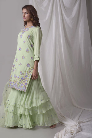 Buy dusty green georgette suit online in USA with palazzo and dupatta. Be the talk of parties and weddings with exquisite designer gowns, sharara suits, Anarkali suits, salwar suits from Pure Elegance Indian clothing store in USA. Shop online now.-side view