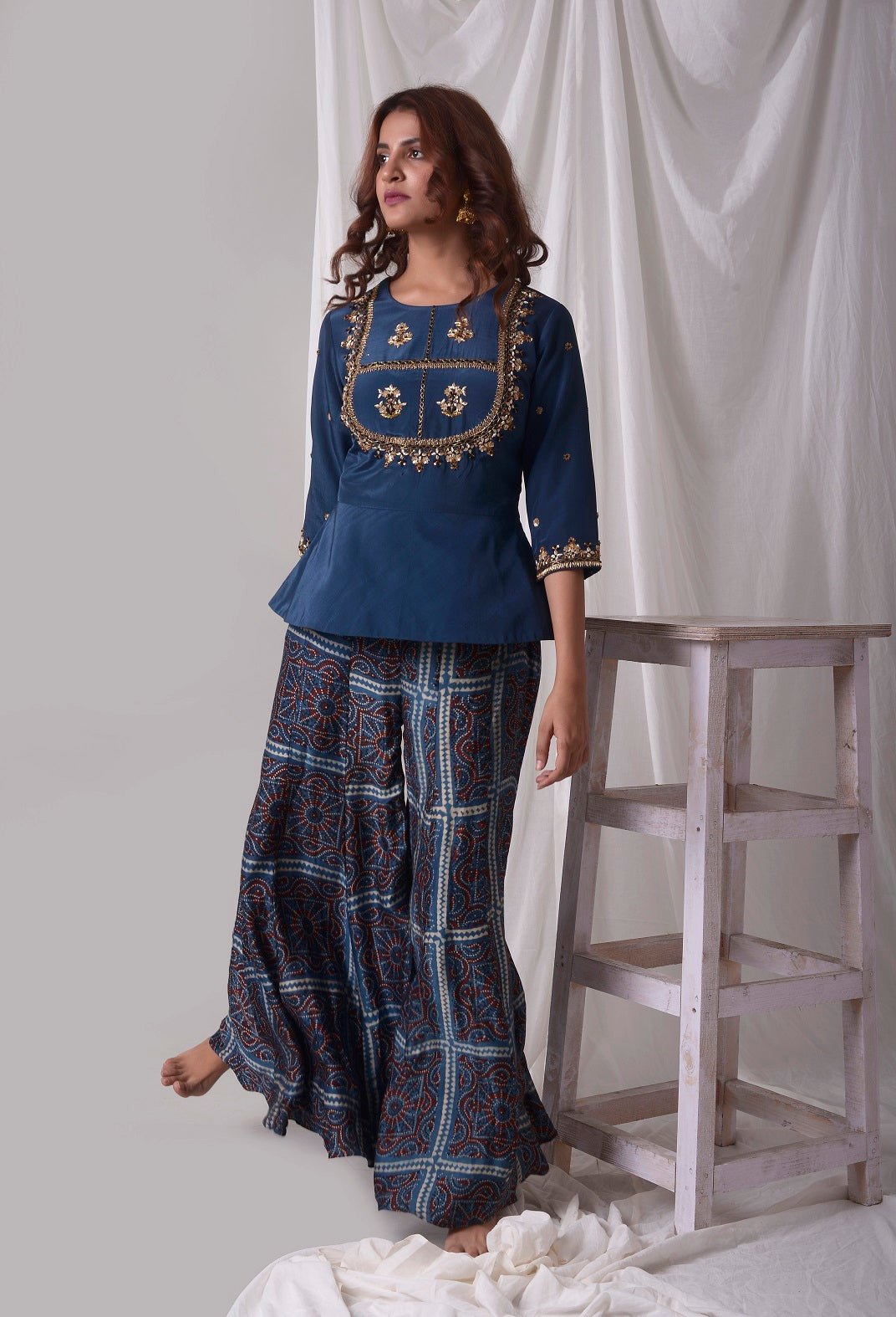 Buy blue modal suit online in USA with palazzo. Be the talk of parties and weddings with exquisite designer gowns, sharara suits, Anarkali suits, salwar suits from Pure Elegance Indian clothing store in USA. Shop online now.-side view
