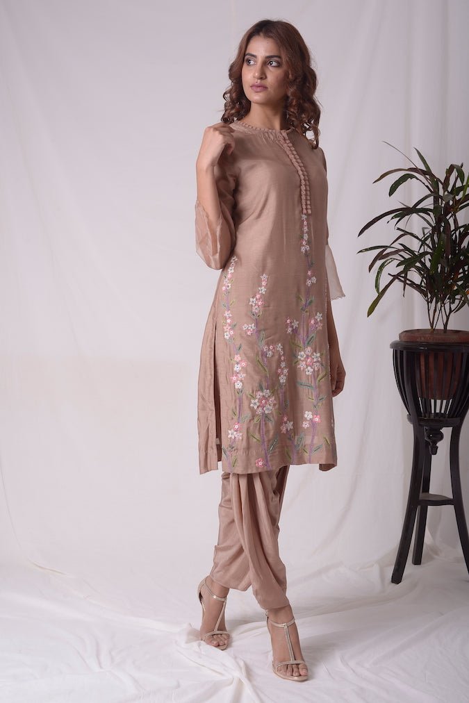 Buy beautiful brown cotton silk suit online in USA. Suit has simple multi color embroidery work. Kurta has 3/4 length sleeves which is net like at border, and dhoti. Simple look makes it elegant. Be the talk of parties and weddings with exquisite designer gowns from Pure Elegance Indian clothing store in USA.-side view