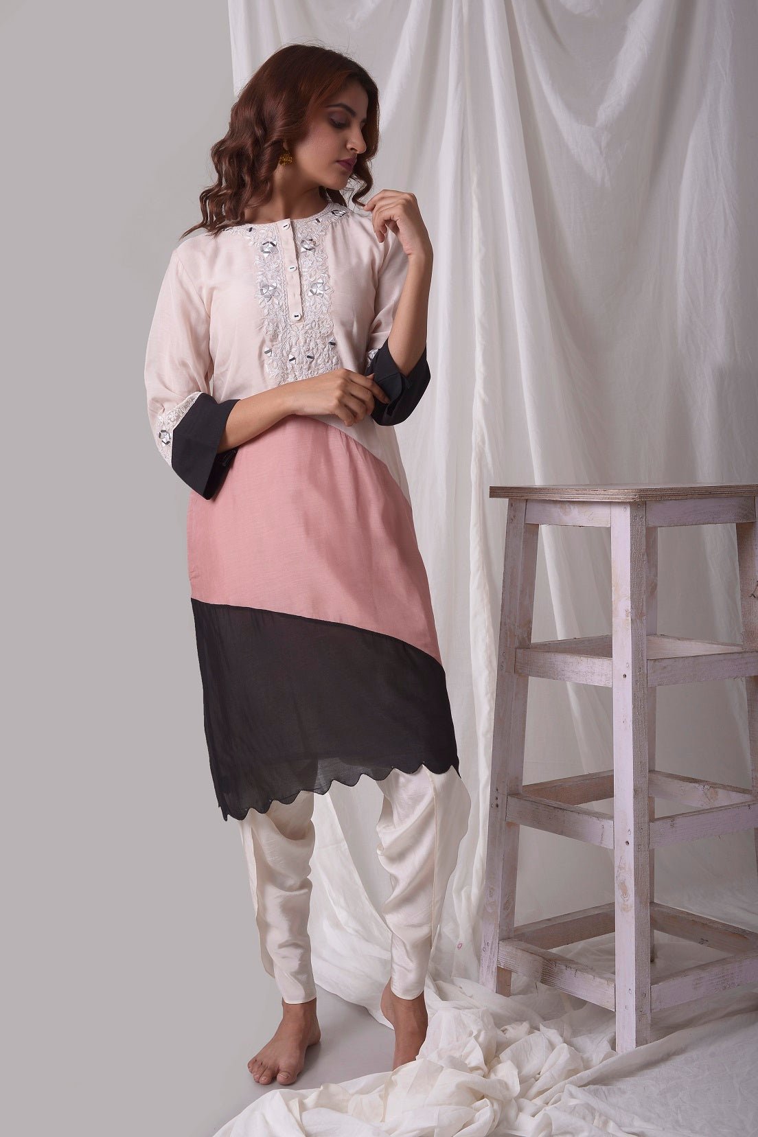 Buy off-white cotton silk suit online in USA. Suit has simple white work. Kurta has 3/4 length sleeves, white dhoti and its multi color with white, pink and black.Simple look makes it elegant. Be the talk of parties and weddings with exquisite designer gowns from Pure Elegance Indian clothing store in USA. Shop online now.-full view