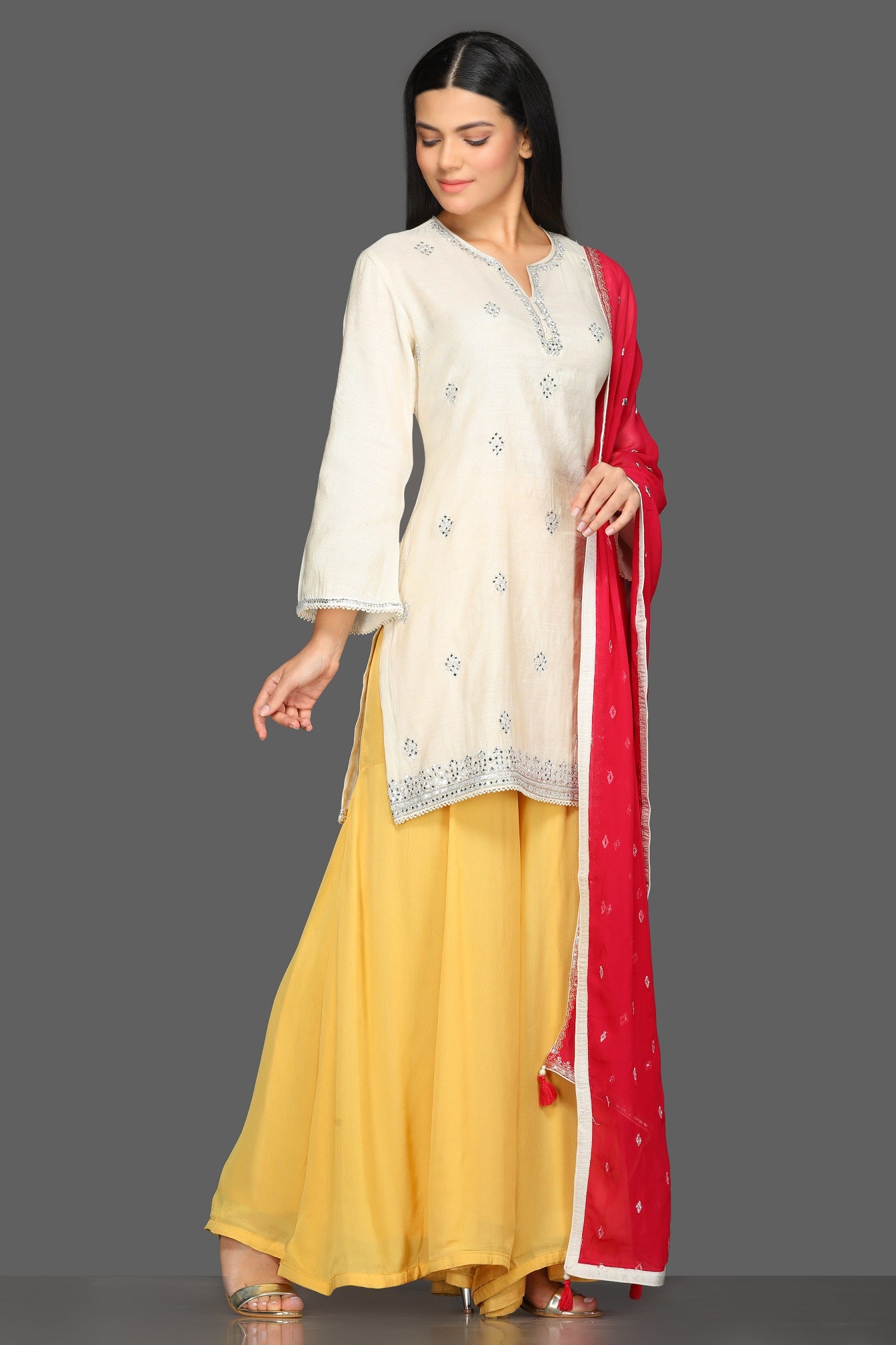 Buy lovely white and yellow embroidered sharara suit online in USA with red dupatta. Dazzle on weddings and special occasions with exquisite Indian designer dresses, sharara suits, Anarkali suits from Pure Elegance Indian fashion store in USA.-front