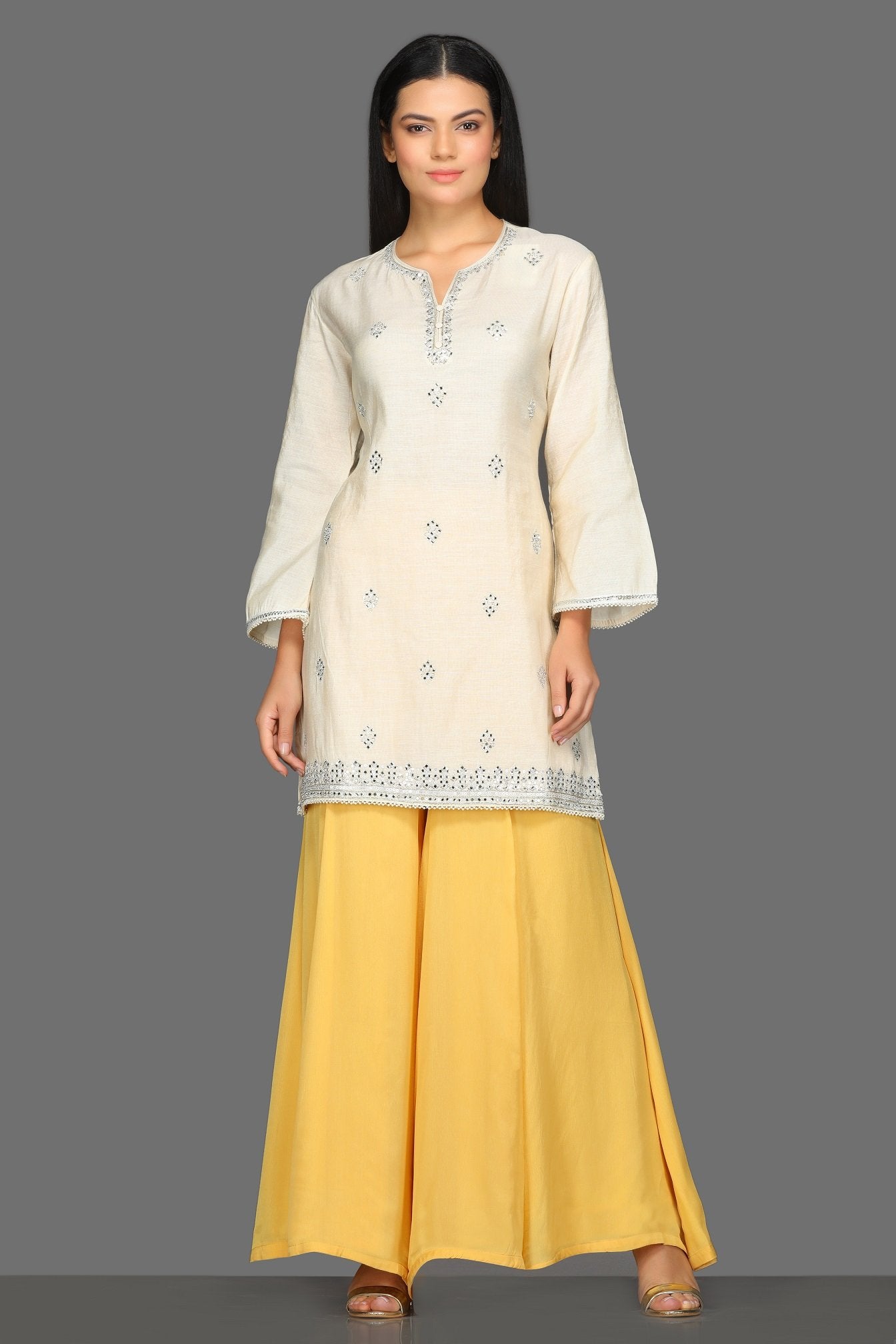 Buy lovely white and yellow embroidered sharara suit online in USA with red dupatta. Dazzle on weddings and special occasions with exquisite Indian designer dresses, sharara suits, Anarkali suits from Pure Elegance Indian fashion store in USA.-without dupatta