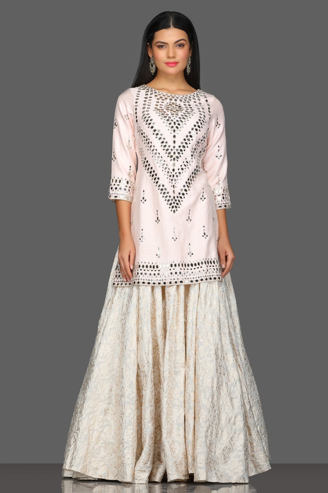 Buy gorgeous powder pink mirror work kurta skirt set online in USA with matching dupatta. Dazzle on weddings and special occasions with exquisite Indian designer dresses, sharara suits, Anarkali suits from Pure Elegance Indian fashion store in USA.-without dupatta