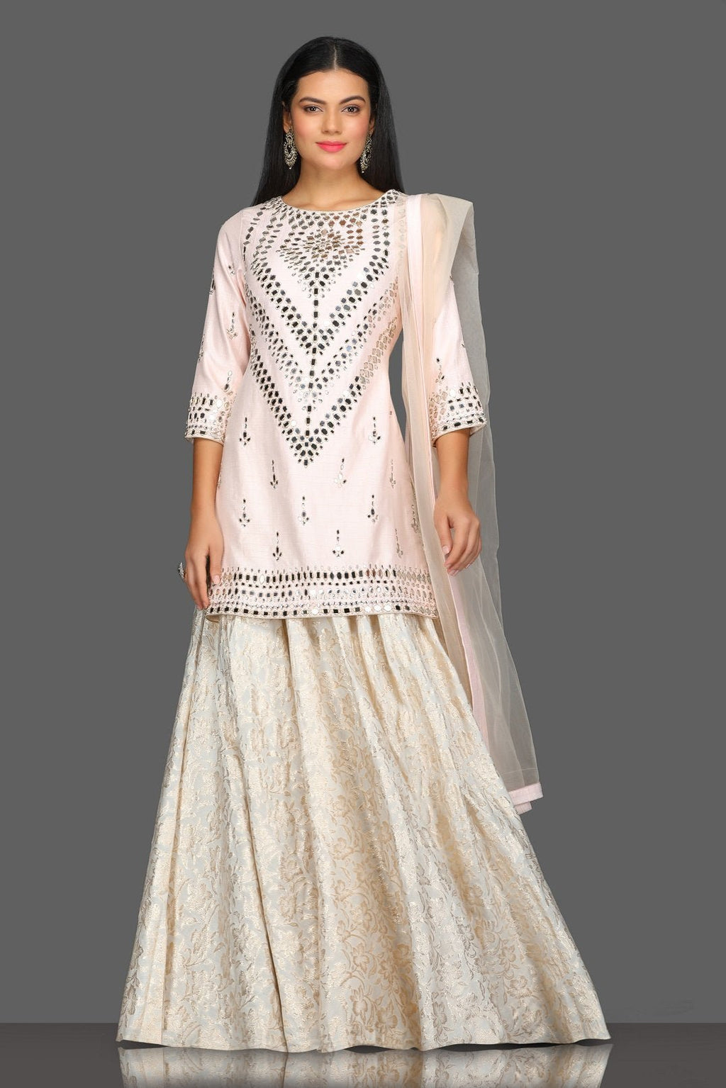 Buy gorgeous powder pink mirror work kurta skirt set online in USA with matching dupatta. Dazzle on weddings and special occasions with exquisite Indian designer dresses, sharara suits, Anarkali suits from Pure Elegance Indian fashion store in USA.-full view