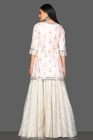 Buy gorgeous powder pink mirror work kurta skirt set online in USA with matching dupatta. Dazzle on weddings and special occasions with exquisite Indian designer dresses, sharara suits, Anarkali suits from Pure Elegance Indian fashion store in USA.-back