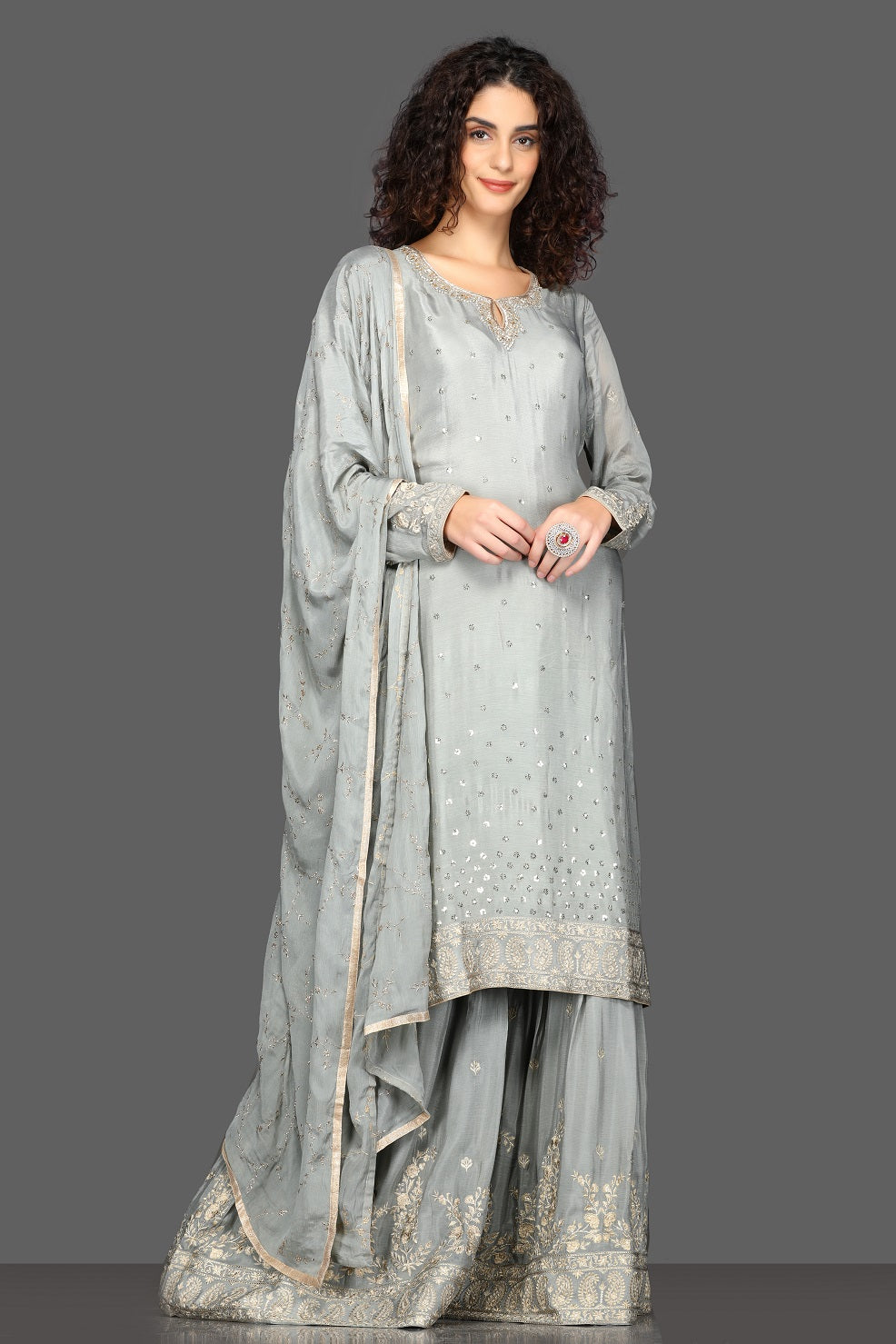 Buy stunning grey embroidered palazzo suit online in USA with matching dupatta. Dazzle on weddings and special occasions with exquisite Indian designer dresses, sharara suits, Anarkali suits from Pure Elegance Indian fashion store in USA.-full view