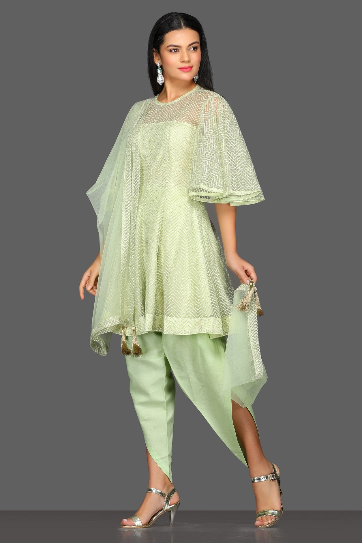 Buy stunning mint green designer suit online in USA with dhoti salwar and dupatta. Dazzle on weddings and special occasions with exquisite Indian designer dresses, sharara suits, Anarkali suits from Pure Elegance Indian fashion store in USA.-left 