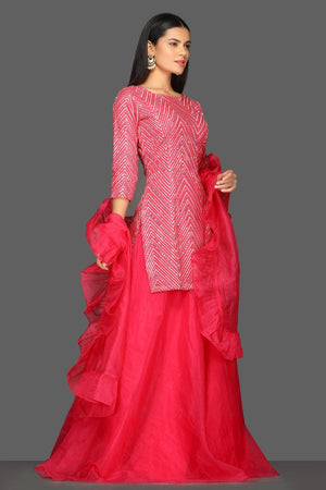 Shop pink embroidered skirt set online in USA with matching dupatta. Dazzle on weddings and special occasions with exquisite Indian designer dresses, sharara suits, Anarkali suits from Pure Elegance Indian fashion store in USA.-right