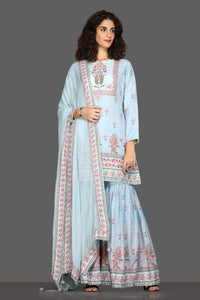 Shop beautiful powder blue floral gharara suit online in USA and matching dupatta. Dazzle on weddings and special occasions with exquisite Indian designer dresses, sharara suits, Anarkali suits from Pure Elegance Indian fashion store in USA.-full view