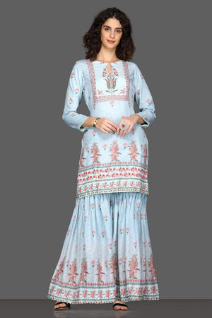 Shop beautiful powder blue floral gharara suit online in USA and matching dupatta. Dazzle on weddings and special occasions with exquisite Indian designer dresses, sharara suits, Anarkali suits from Pure Elegance Indian fashion store in USA.-front
