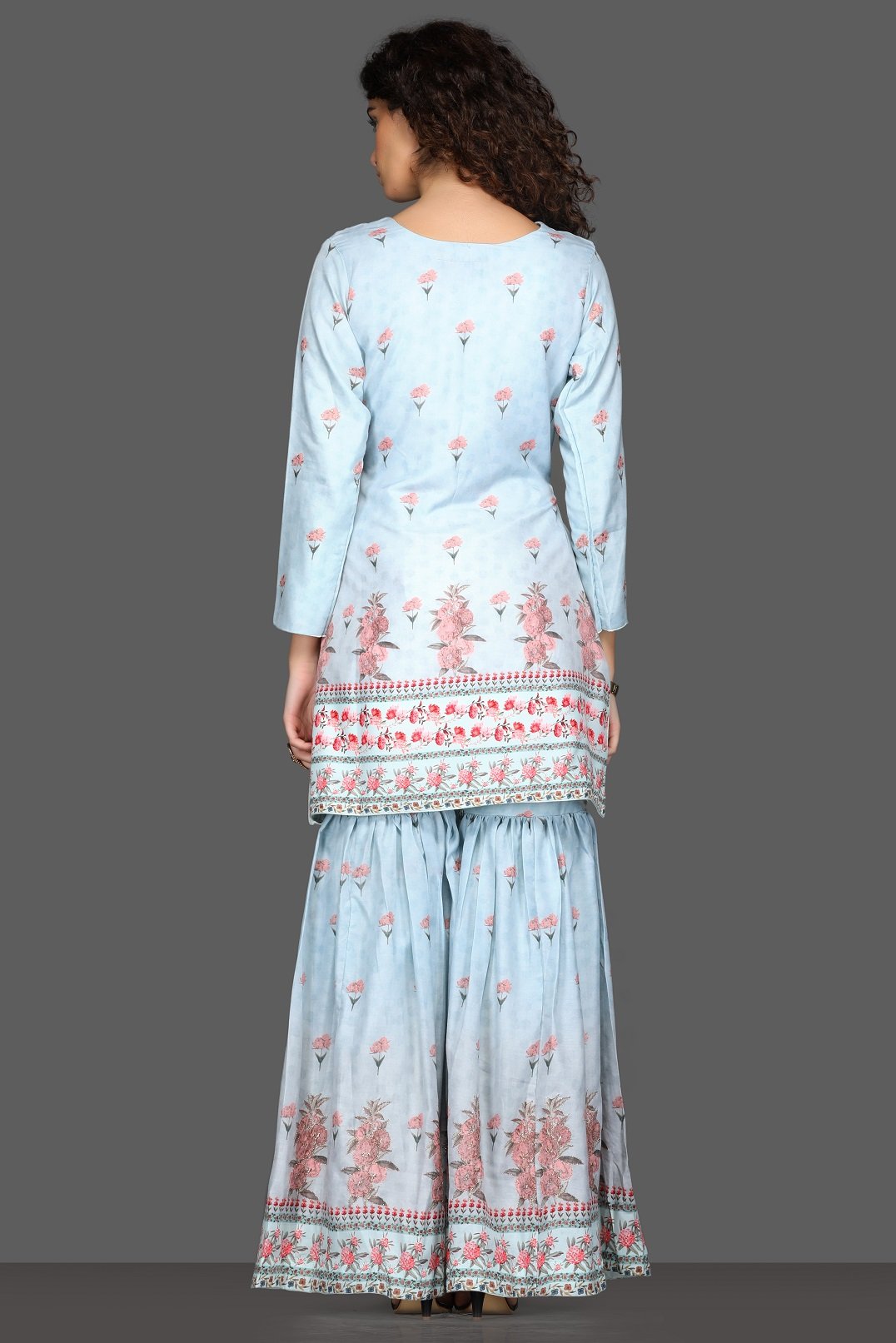 Shop beautiful powder blue floral gharara suit online in USA and matching dupatta. Dazzle on weddings and special occasions with exquisite Indian designer dresses, sharara suits, Anarkali suits from Pure Elegance Indian fashion store in USA.-back