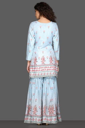 Shop beautiful powder blue floral gharara suit online in USA and matching dupatta. Dazzle on weddings and special occasions with exquisite Indian designer dresses, sharara suits, Anarkali suits from Pure Elegance Indian fashion store in USA.-back