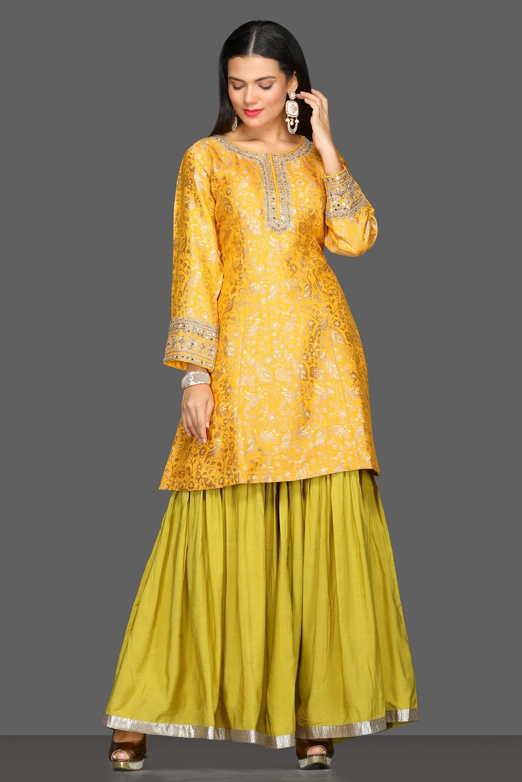Buy yellow and green embroidered skirt set online in USA with pink dupatta. Dazzle on weddings and special occasions with exquisite Indian designer dresses, sharara suits, Anarkali suits from Pure Elegance Indian fashion store in USA.-side