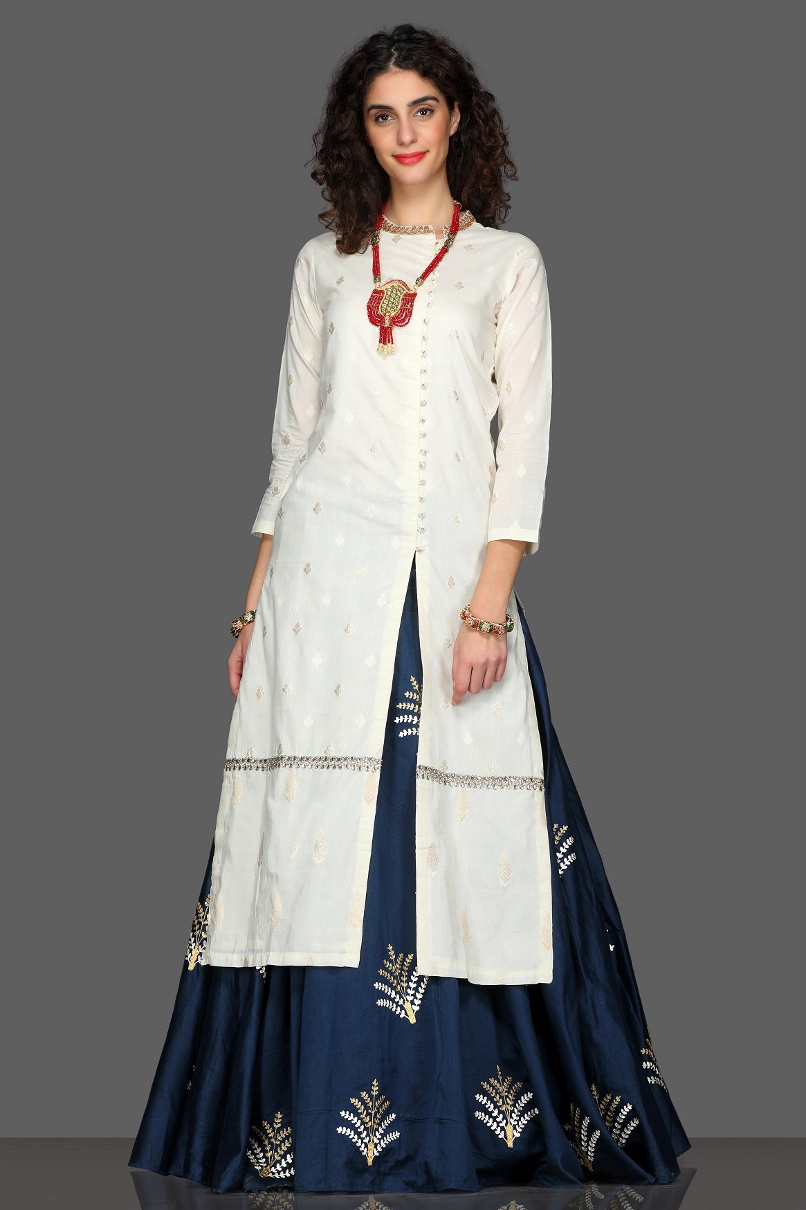 Buy elegant embroidered kurta with navy skirt online in USA and cream dupatta. Dazzle on weddings and special occasions with exquisite Indian designer lehengas, sharara suits, Anarkali suits from Pure Elegance Indian fashion store in USA.-kurta