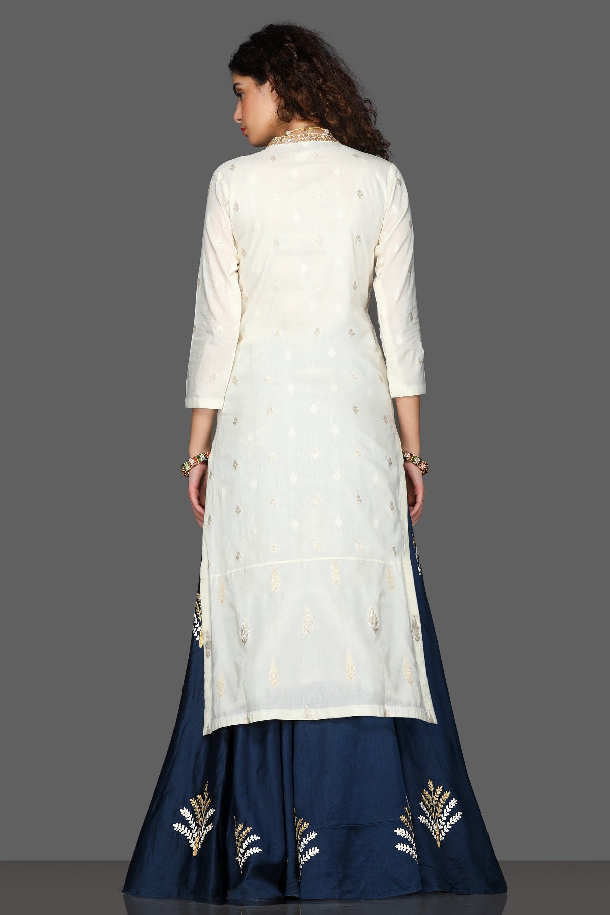 Buy elegant embroidered kurta with navy skirt online in USA and cream dupatta. Dazzle on weddings and special occasions with exquisite Indian designer lehengas, sharara suits, Anarkali suits from Pure Elegance Indian fashion store in USA.-back