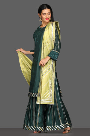 Buy stunning dark green gota work palazzo suit online in USA with pista green dupatta. Dazzle on weddings and special occasions with exquisite Indian designer lehengas, sharara suits, Anarkali suits from Pure Elegance Indian fashion store in USA.-side