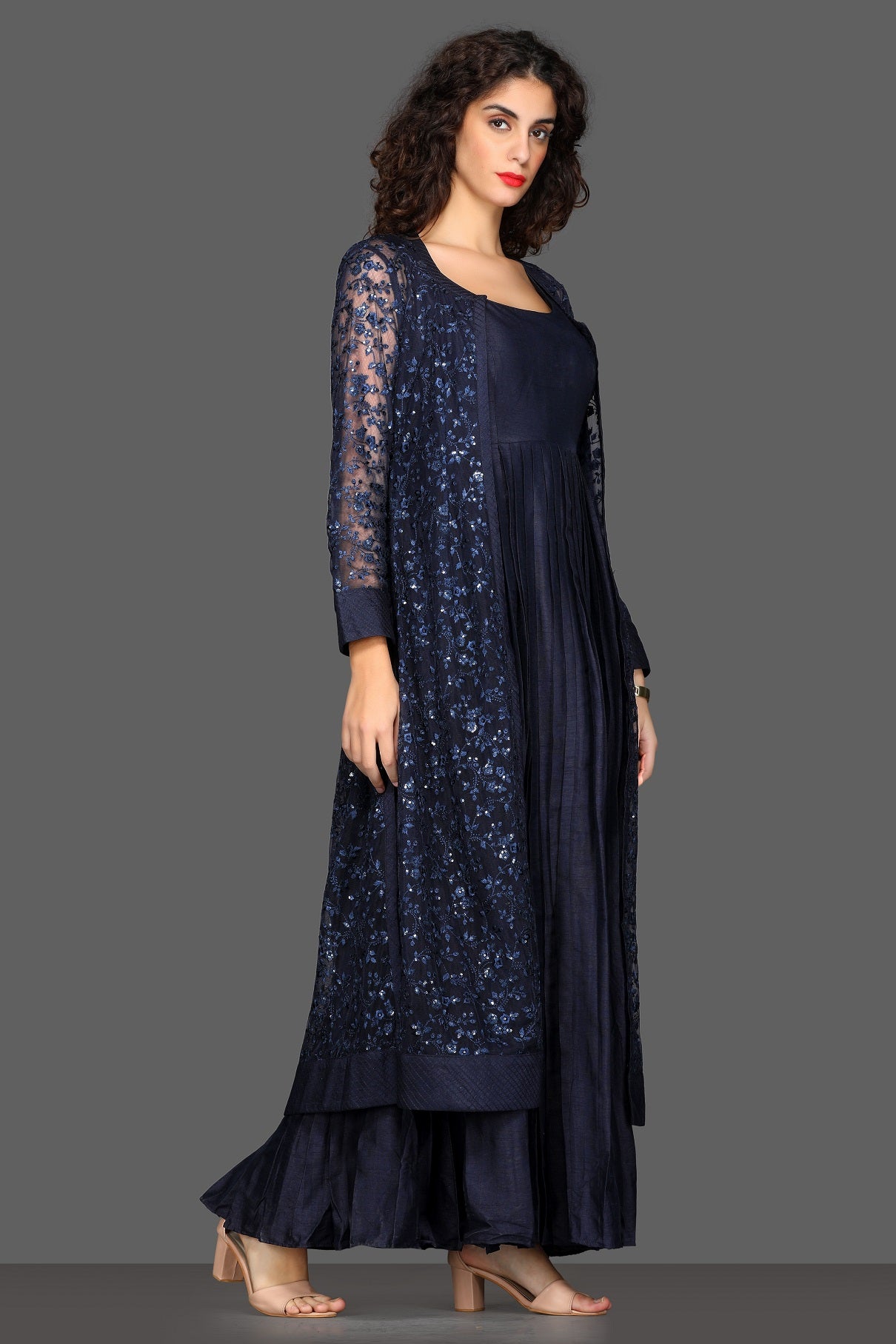 Shop navy blue maxi dress online in USA with long embroidered shrug. Dazzle on weddings and special occasions with exquisite Indian designer lehengas, sharara suits, Anarkali suits, Indowestern dresses from Pure Elegance Indian fashion store in USA.-right