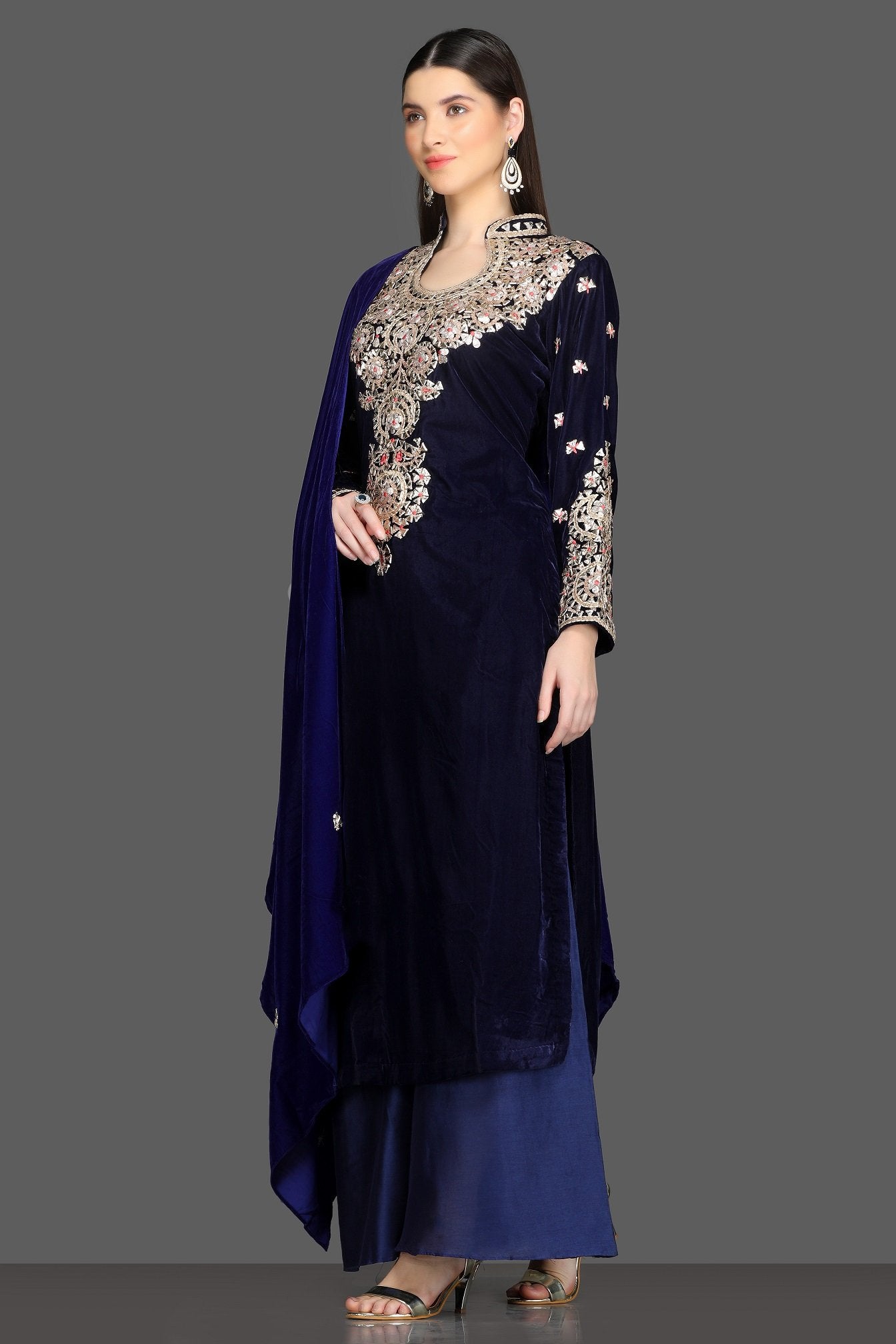 Shop royal blue embroidered velvet palazzo suit online in USA with dupatta. Dazzle on weddings and special occasions with exquisite Indian designer lehengas, sharara suits, Anarkali suits, Indowestern dresses from Pure Elegance Indian fashion store in USA.-left
