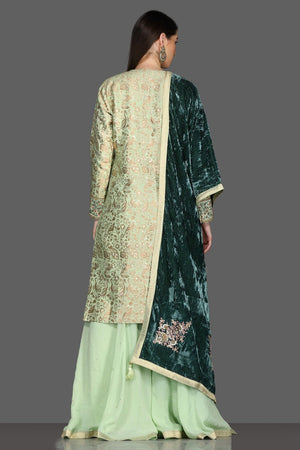 Shop beautiful mint green palazzo suit online in USA with green velvet dupatta. Dazzle on weddings and special occasions with exquisite Indian designer dresses, sharara suits, Anarkali suits from Pure Elegance Indian fashion store in USA.-back